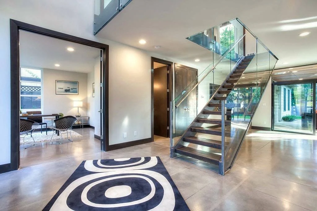 Polished concrete and hardwood flooring installation in an Eastside home entryway